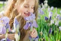 Little girl smelling flower