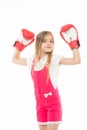 Little girl smile after boxing training isolated on white. Happy child raised hands in boxing gloves. Punching Royalty Free Stock Photo