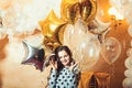 Little girl smile with golden silver star balloons, christmas. Happy child celebrate new year and xmas holidays. New Royalty Free Stock Photo