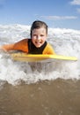 Little girl Bodyboarding in the Sea