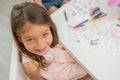 Little girl smiling in coloring and drawing classroom. Back to school and summer Royalty Free Stock Photo