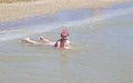 Little girl smiling while playing with the mask diving