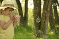 Little girl with soap bubbles