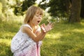 Little girl with soap bubbles