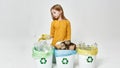 Little girl sorting plastic bottle in variety bins