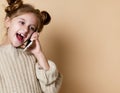 Little girl speaking by cell phone, background Royalty Free Stock Photo