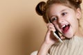 Little girl speaking by cell phone, background Royalty Free Stock Photo