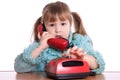 The little girl speaks by phone