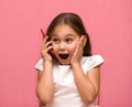 Little girl speaks on the phone. Surprise