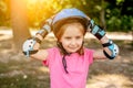 Little girl in sport protective equipment