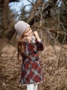 Little girl in spring forest and pussy-willow twigs Royalty Free Stock Photo