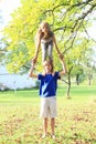 Little girl standing on boy Royalty Free Stock Photo