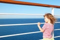 Little girl standing on deck of cruise ship