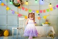 A little girl is standing in a decorated room Royalty Free Stock Photo