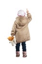 A little girl standing with his back pointing her finger. Royalty Free Stock Photo