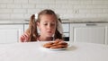 Little girl stealing cookie. the child steal cookies