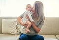 This little girl stole my heart. a young mother and her baby at home.