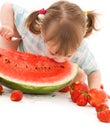 Little girl with strawberry and watermelon Royalty Free Stock Photo