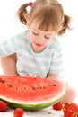 Little girl with strawberry and watermelon Royalty Free Stock Photo