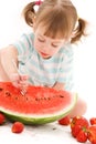 Little girl with strawberry and watermelon Royalty Free Stock Photo