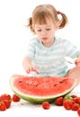 Little girl with strawberry and watermelon Royalty Free Stock Photo