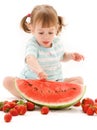 Little girl with strawberry and watermelon Royalty Free Stock Photo