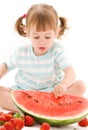 Little girl with strawberry and watermelon Royalty Free Stock Photo