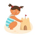 Little girl building sand castle on summer beach Royalty Free Stock Photo