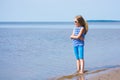 Little girl in a striped vest and hat Royalty Free Stock Photo