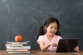 Little girl student browsing online e-learning