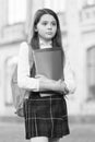 Little girl student school uniform and backpack hold books, academic year concept