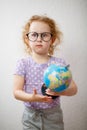 A Little Girl Studying The Globe. concept of education Royalty Free Stock Photo