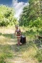 Little girl with a suitcase at the railway Royalty Free Stock Photo