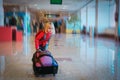 Little girl with suitcase travel in airport Royalty Free Stock Photo