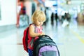 Little girl with suitcase travel in the airport Royalty Free Stock Photo