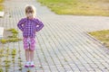 Little girl on summer day standing with hands on hips Royalty Free Stock Photo