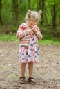 little girl in a summer dress, mood swings, bad mood, Royalty Free Stock Photo