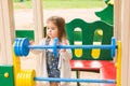 Little girl on the summer playground