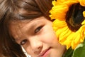 Little Girl and Sunflower Royalty Free Stock Photo