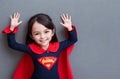Little girl superhero. Portrait of happy kid with smile on face in fantastic costume. Generative AI.