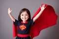 Little girl superhero. Portrait of happy kid with smile on face in fantastic costume. Generative AI.