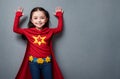 Little girl superhero. Portrait of happy kid with smile on face in fantastic costume. Generative AI.