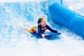 Little girl surfing in beach wave simulator Royalty Free Stock Photo