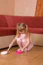 The little girl sweeps a floor Royalty Free Stock Photo