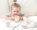 Little girl with sweets around her Royalty Free Stock Photo