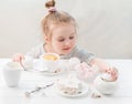 Little girl with sweets around her Royalty Free Stock Photo