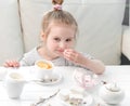 Little girl with sweets around her Royalty Free Stock Photo