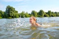 Little girl swim on river
