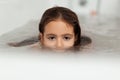 Little girl swiming in the bath Royalty Free Stock Photo