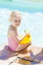 Little girl by swimming pool Royalty Free Stock Photo